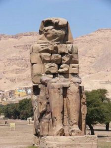 The Colossi of Memnon are two massive stone statues of