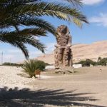 The Colossi of Memnon are two massive stone statues of