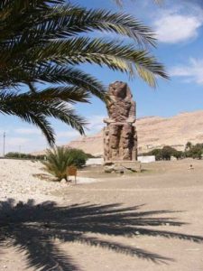 The Colossi of Memnon are two massive stone statues of