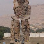 The Colossi of Memnon are two massive stone statues of