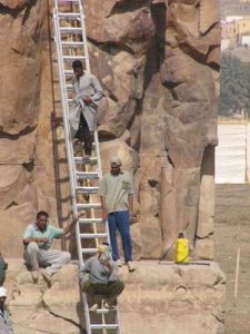 The Colossi of Memnon are two massive stone statues of