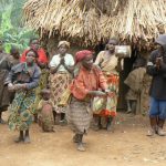 Lake Bunyonyi Pigmy villagers dance for tourists for money. The village