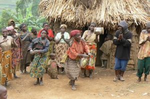 Lake Bunyonyi Pigmy villagers dance for tourists for money. The village