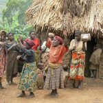 Lake Bunyonyi Pigmy villagers dance for tourists for money. These people