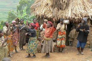 Lake Bunyonyi Pigmy villagers dance for tourists for money. These people