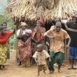 Lake Bunyonyi Pigmy villagers dance for tourists for money. These people