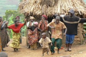 Lake Bunyonyi Pigmy villagers dance for tourists for money. These people