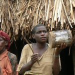 Lake Bunyonyi pigmy elder dancing to a drum and song