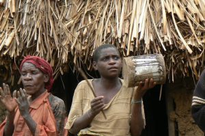 Lake Bunyonyi pigmy elder dancing to a drum and song