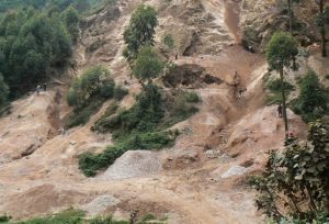 Lake Bunyonyi quarry where stone breakers break boulders into rocks