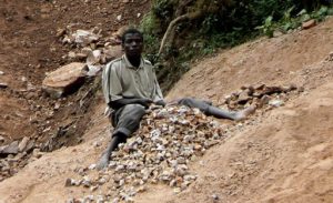 Lake Bunyonyi stone breakers break boulders into rocks into small