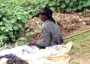 Lake Bunyonyi village market clothing vendor