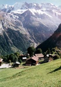 Switzerland - Alpine villages and farms can be seen at