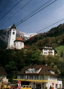 Switzerland - a village in the Alps with train electric