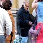 Seville - beggar at the door