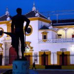 Seville in the evening outside the bullring with matador statue