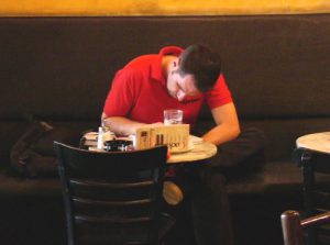 Making notes in a gay cafe