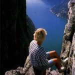 Guy overlooking fjord