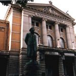 Oslo national theatre with Ibsen's statue