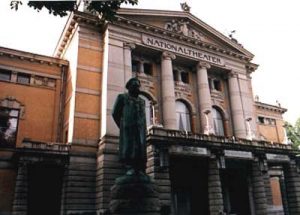 Oslo national theatre with Ibsen's statue