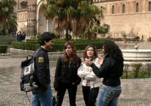 People talking just outside the enormous cathedral