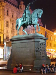 Colorful Ban Jelacic Square and statue at night