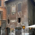 House with fading exterior frescos;  Rome