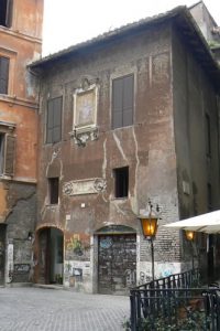 House with fading exterior frescos;  Rome