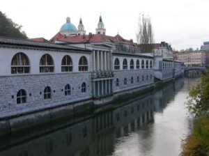 Ljubljana - marketplace and St Nicholas Cathedral along the Ljubljanica