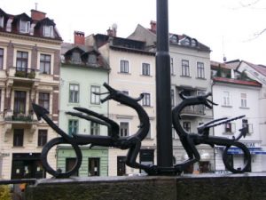 Ljubljana - riverfront houses and sculpture