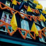 Side of a building with flags.