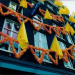 Side of a building with flags.