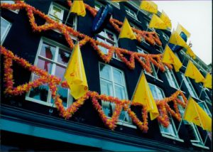 Side of a building with flags.