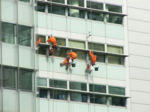 Window cleaners hanging on to their