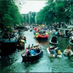 Boats fill the water during the Gay Pride Canal Parade.