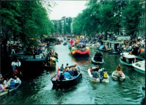 Boats fill the water during the Gay Pride Canal Parade.