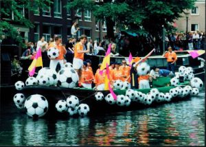 Boat with soccer balls attached.
