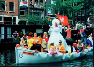 Gay pride boat playing music.