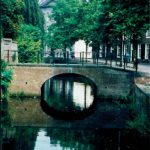 Photograph of a bridge with a reflection in the water