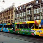 A train with large scale advertisements.