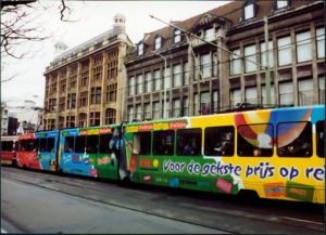 A train with large scale advertisements.