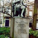 Public statue sits above the streets.