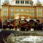 Water fountain in front of a hotel.