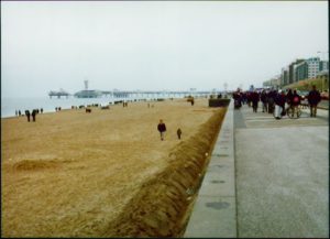 Street and beach of people walking.