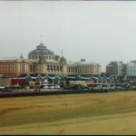 Image of the beach with beautiful buildings in the background.
