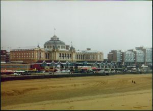 Image of the beach with beautiful buildings in the background.
