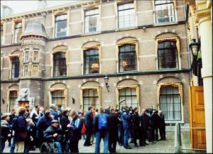 People crowding around the building.