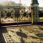 A highly detailed gate entrance with the sun casting a