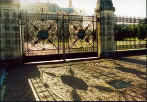 A highly detailed gate entrance with the sun casting a