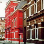 Red and brown brick buildings nestled side by side on